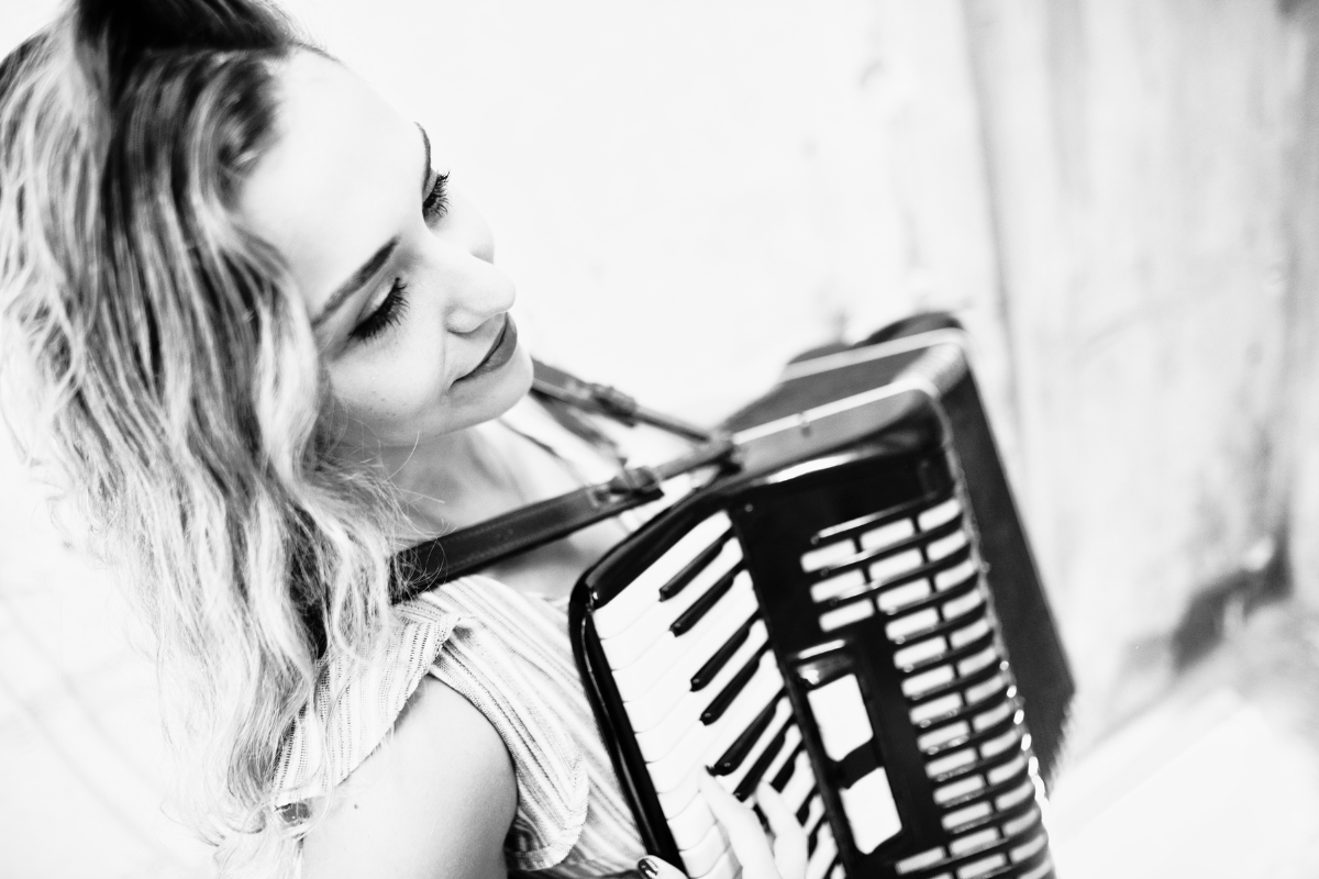 woman playing an accordion